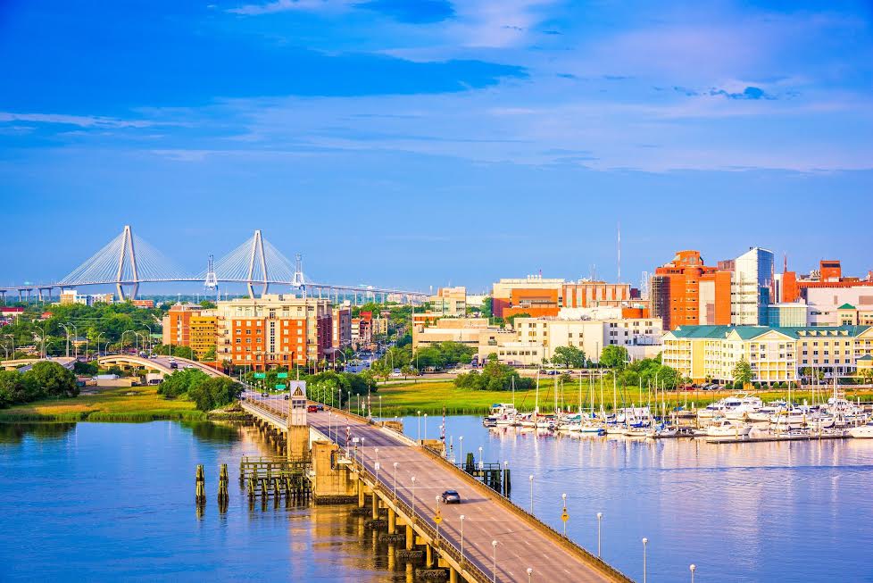 Waterfront city skyline with bridge and marina
